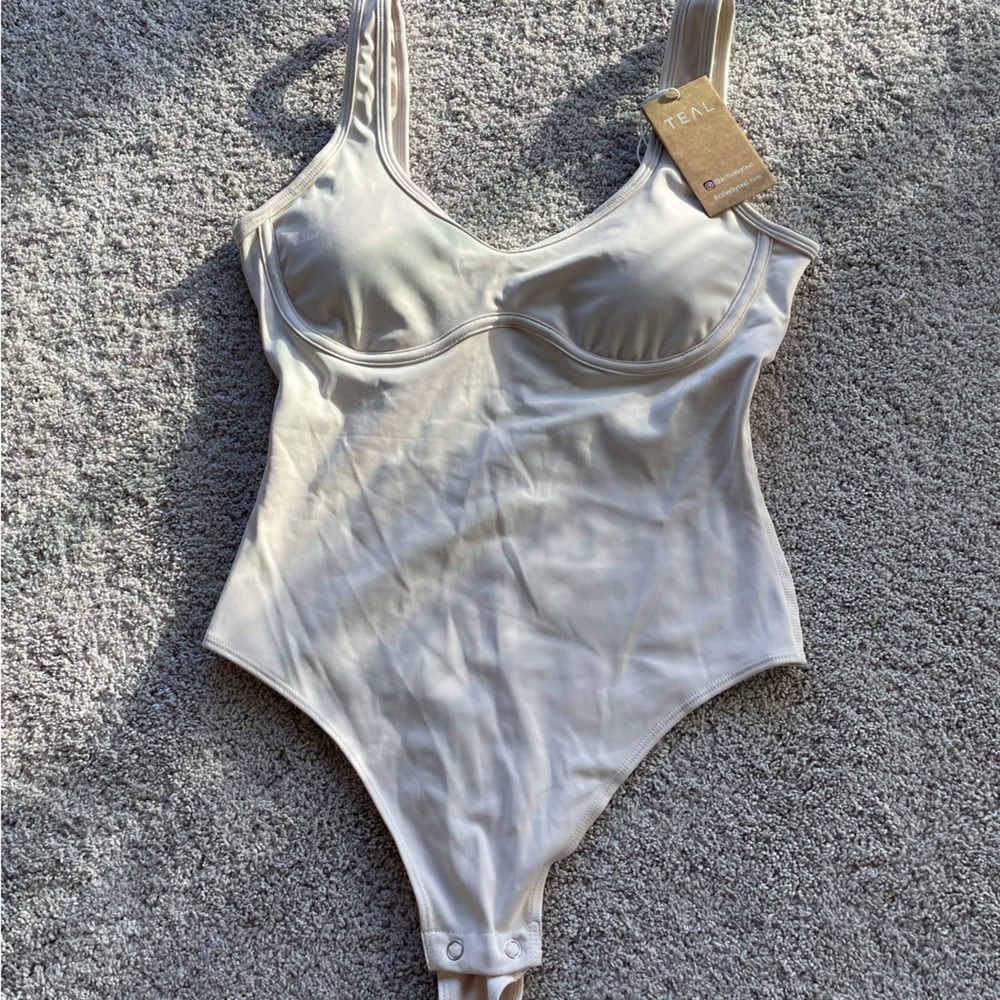 Elegant Cream Bodysuit by TNA